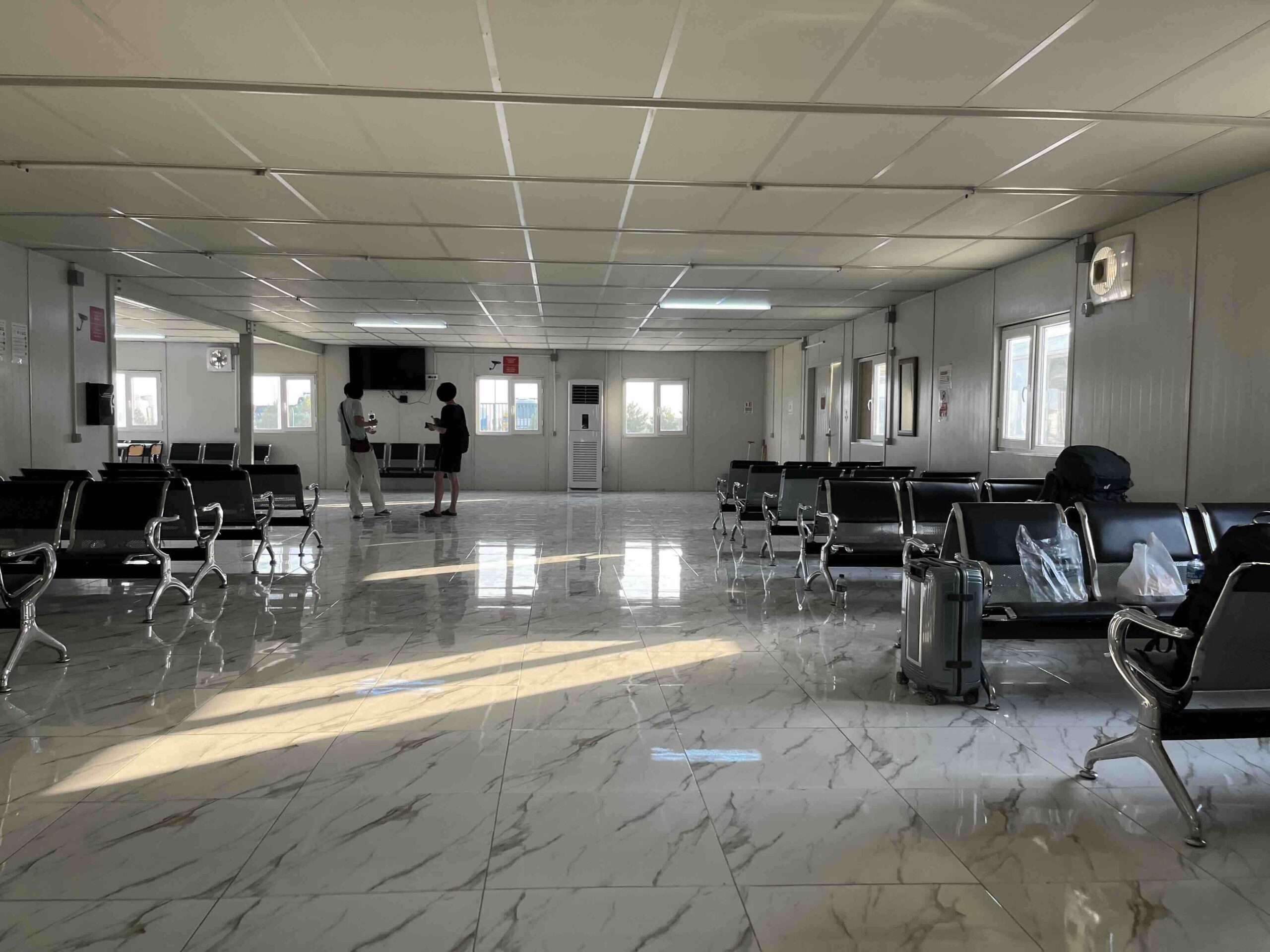 Waiting room with plenty of seating options at the Alat port