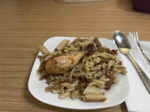 Plate with pasta and chicken on the Caspian Sea ferry