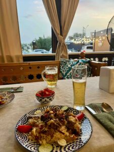 Photo of rice dish (Plov) with 2 beer in a restaurant