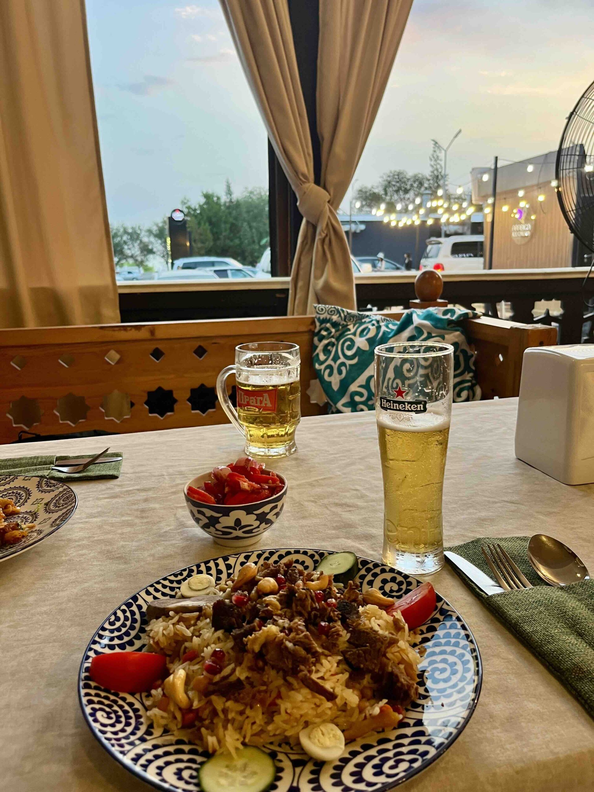 Photo of rice dish (Plov) with 2 beer in a restaurant
