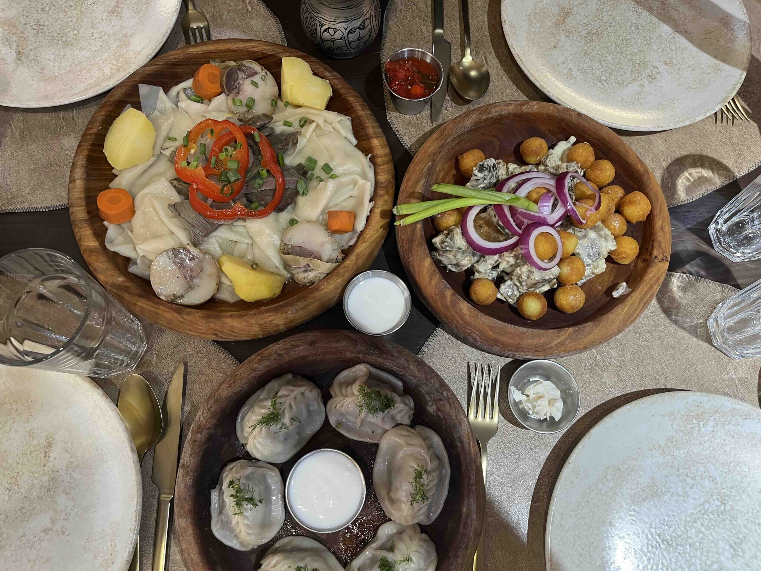 Three different hearty dishes on a table