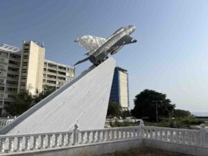 A monument featuring a military aircraft that points towards the sky
