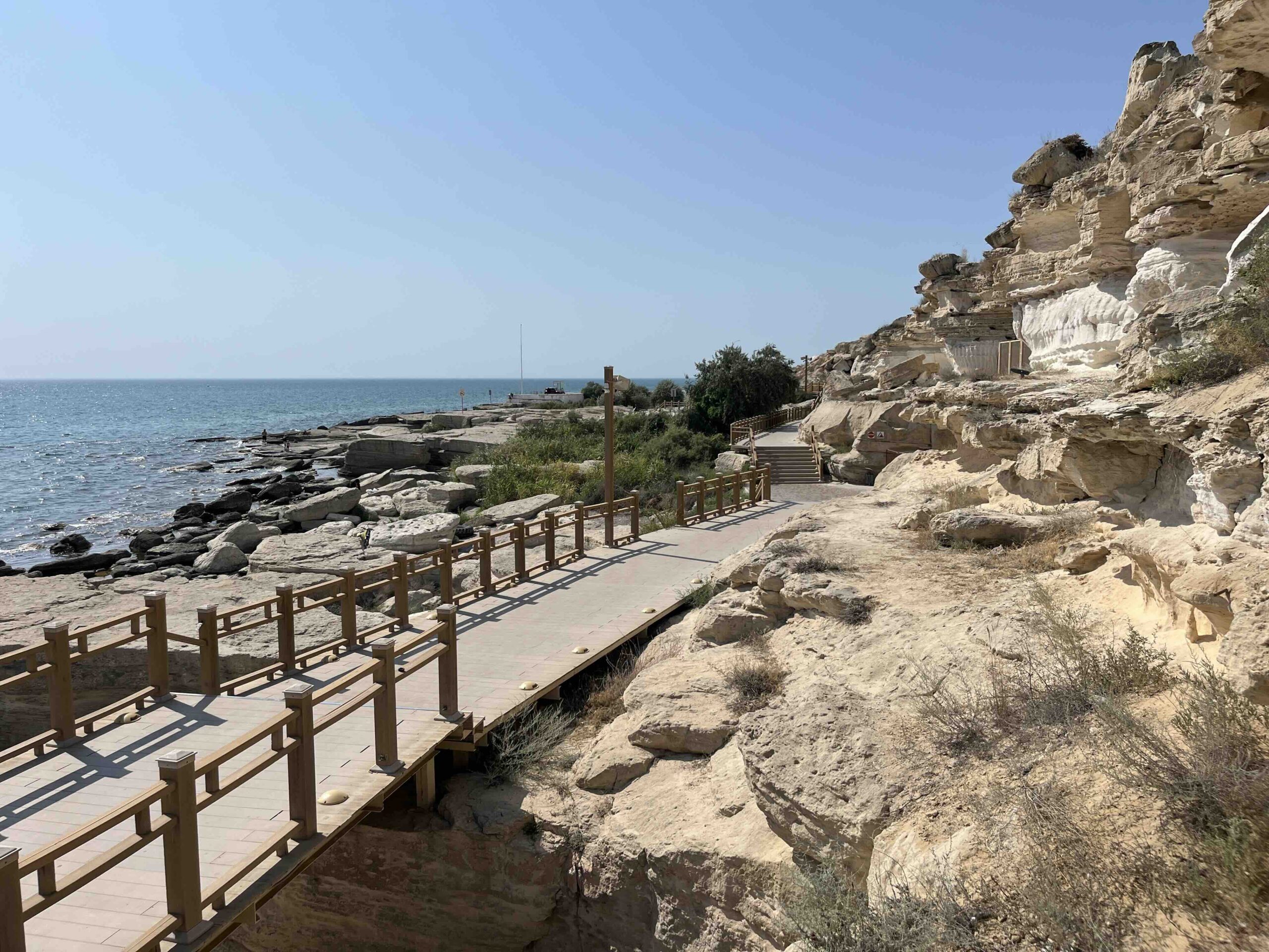 Trail along a rocky cliff, the Caspian Sea in the background